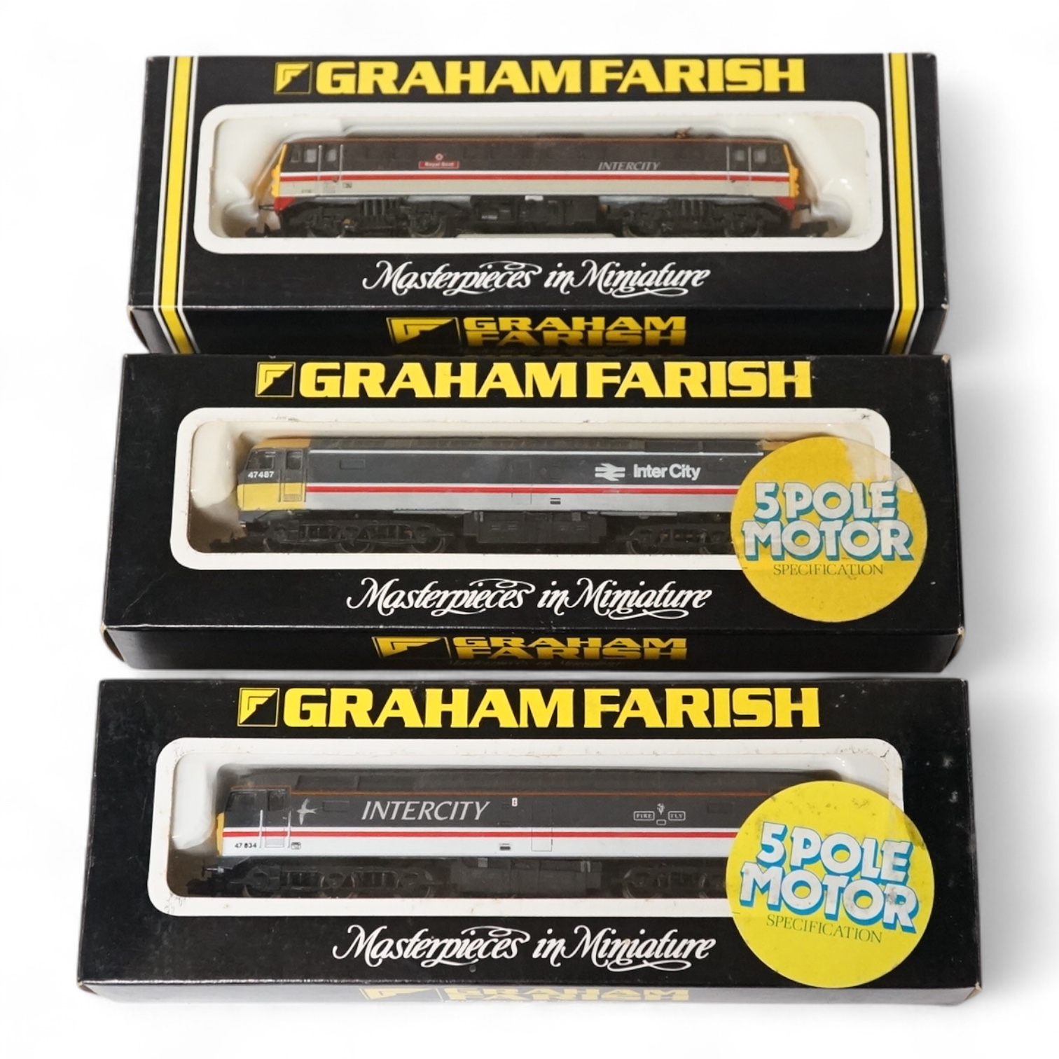 Three boxed Graham Farish N gauge railway locomotives in BR Intercity livery; a class 47 47487 (8026), a class 47 Fire Fly 47834 (8028), and a class 87 Royal Scot 87001 (8837). Condition - good.